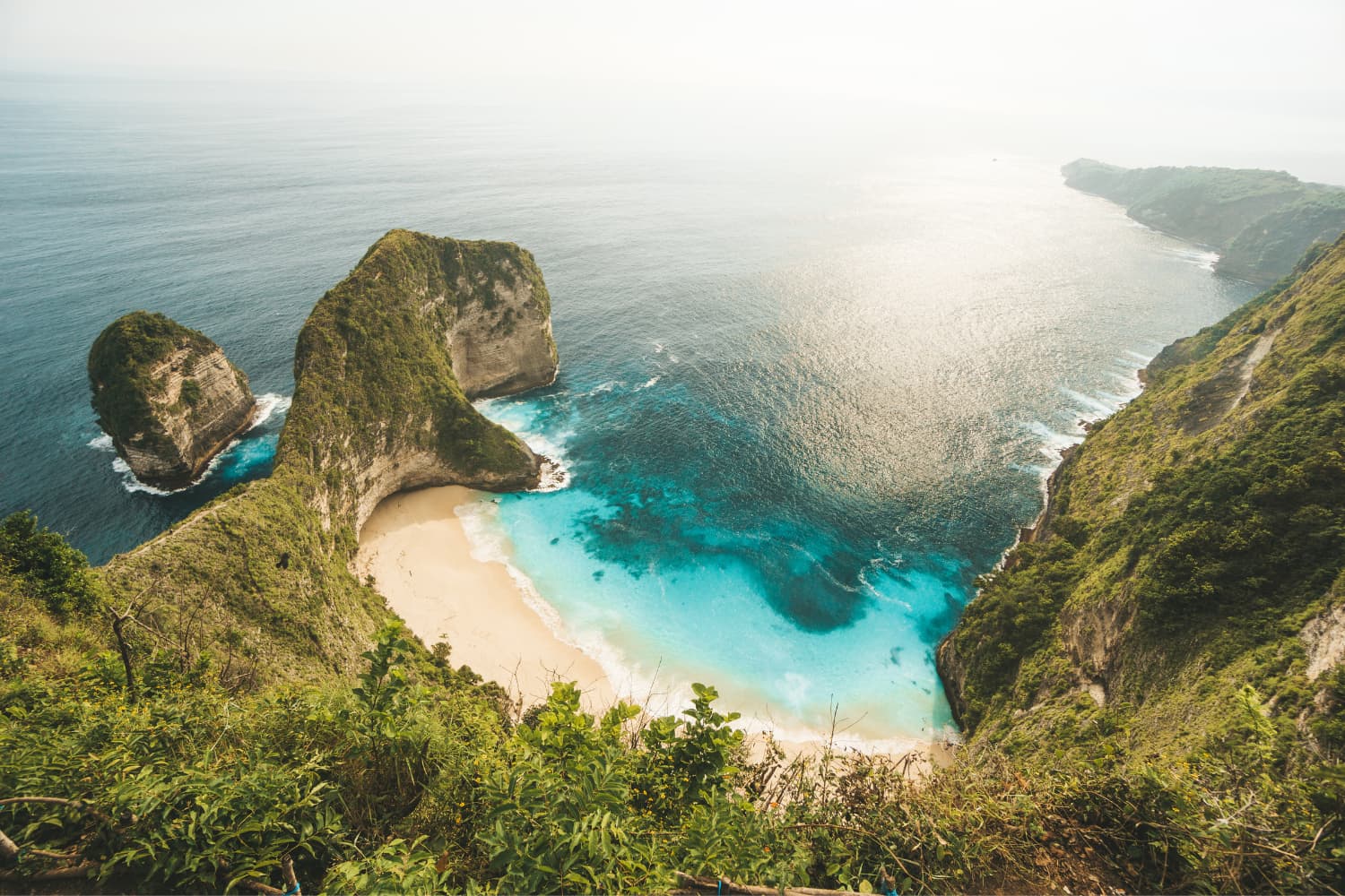 Uluwatu Temple silhouetted on a clifftop at sunset in Bali