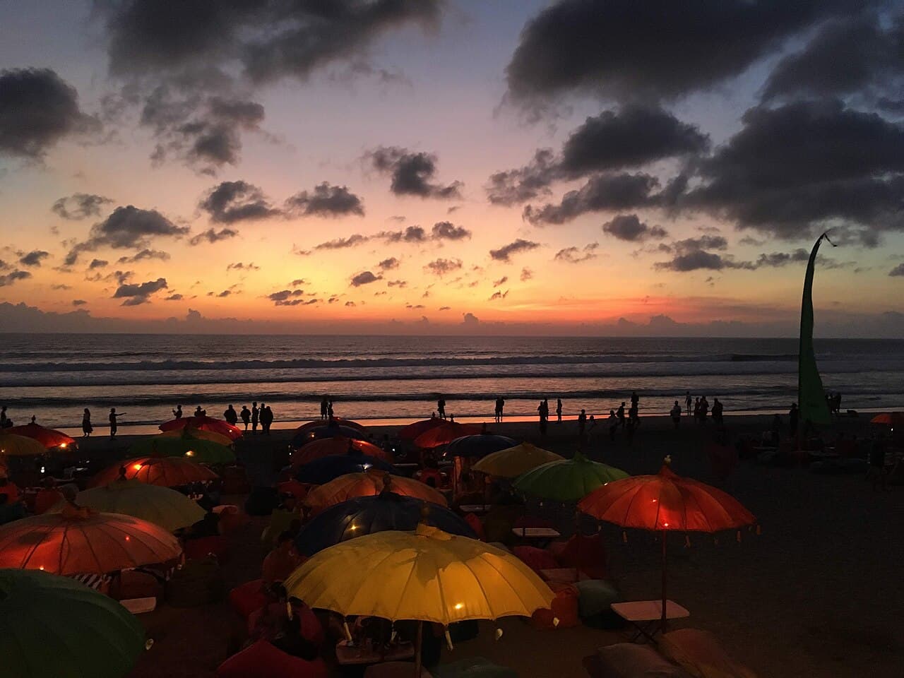 Lantern-lit beach club at sunset on Seminyak Beach, Bali