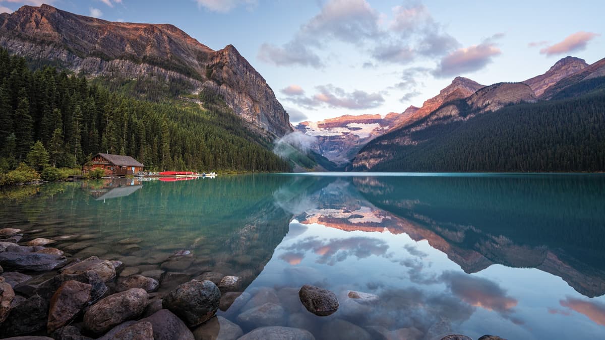 Canoes docked on the turquoise water of Lake Louise in Banff National Park