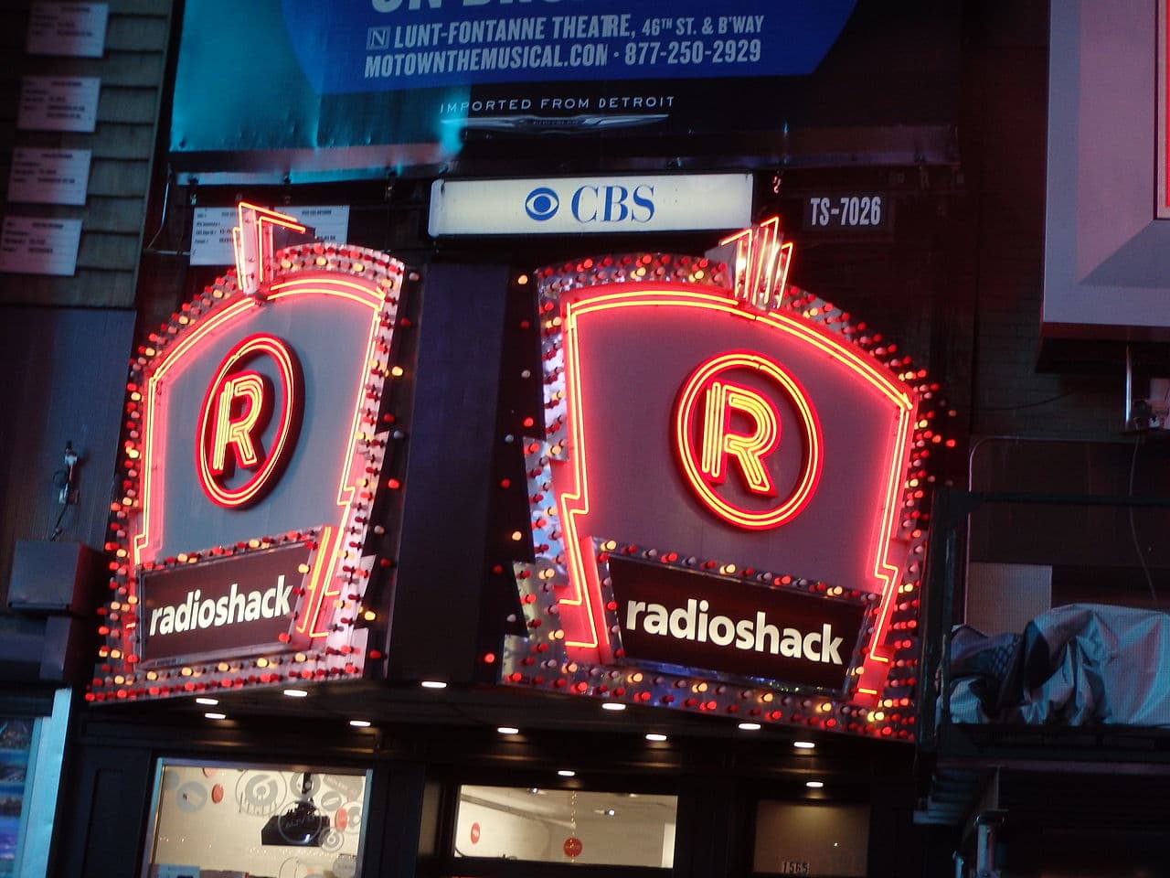 Times Square lit up with neon signs at night